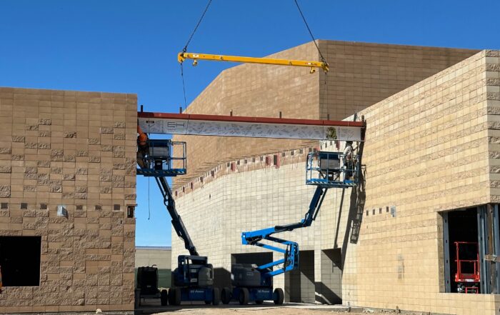 Final support beam placed on structure for topping out ceremony